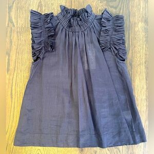 NEW-SEA NY Navy sleeveless blouse with high neck. Ruffles at neck and shoulders.